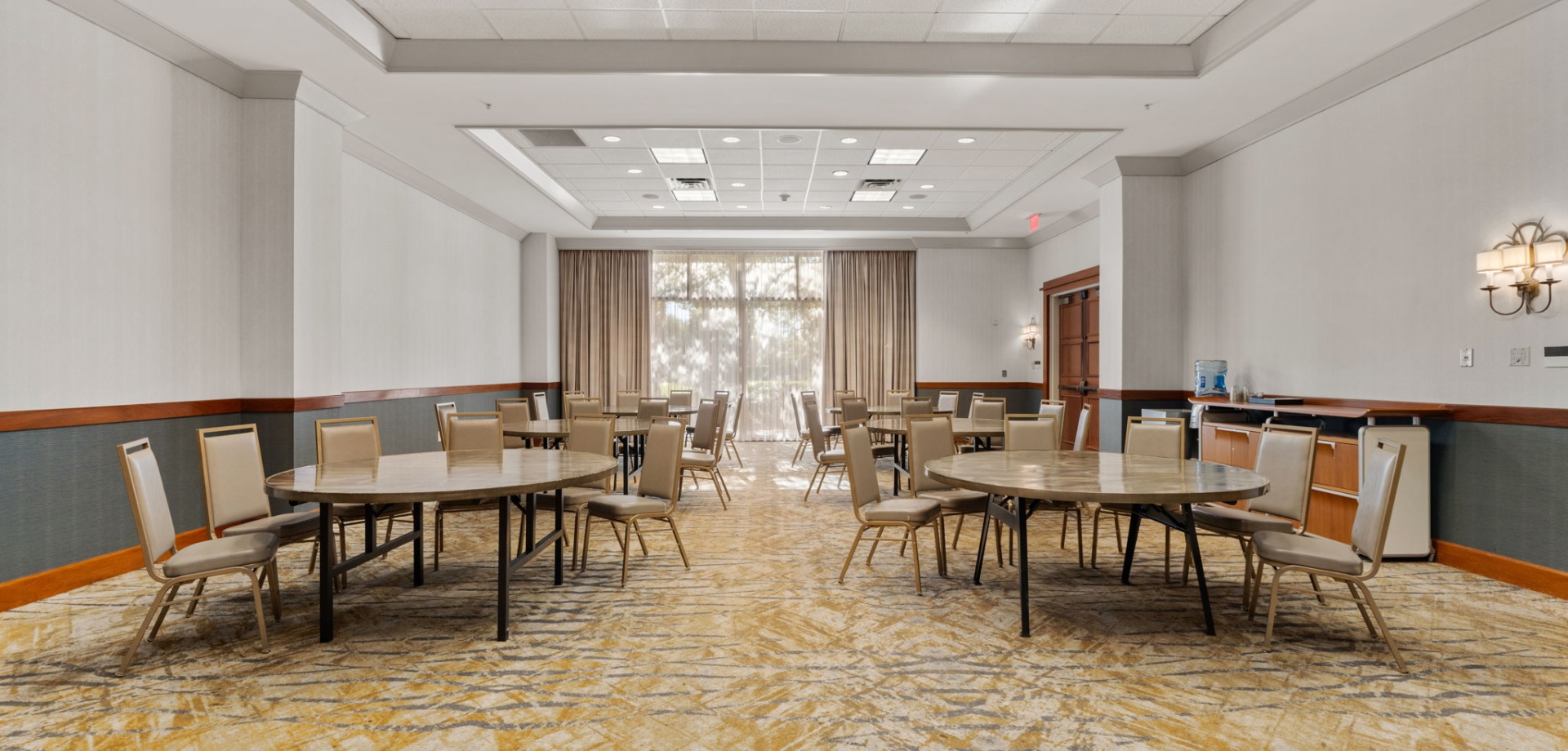 Meeting room with large windows allowing natural light to shine through