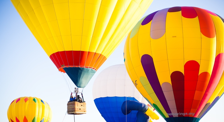 Colorful hot air balloons soaring at Hudson WI Hot Air Balloon Festival 2025