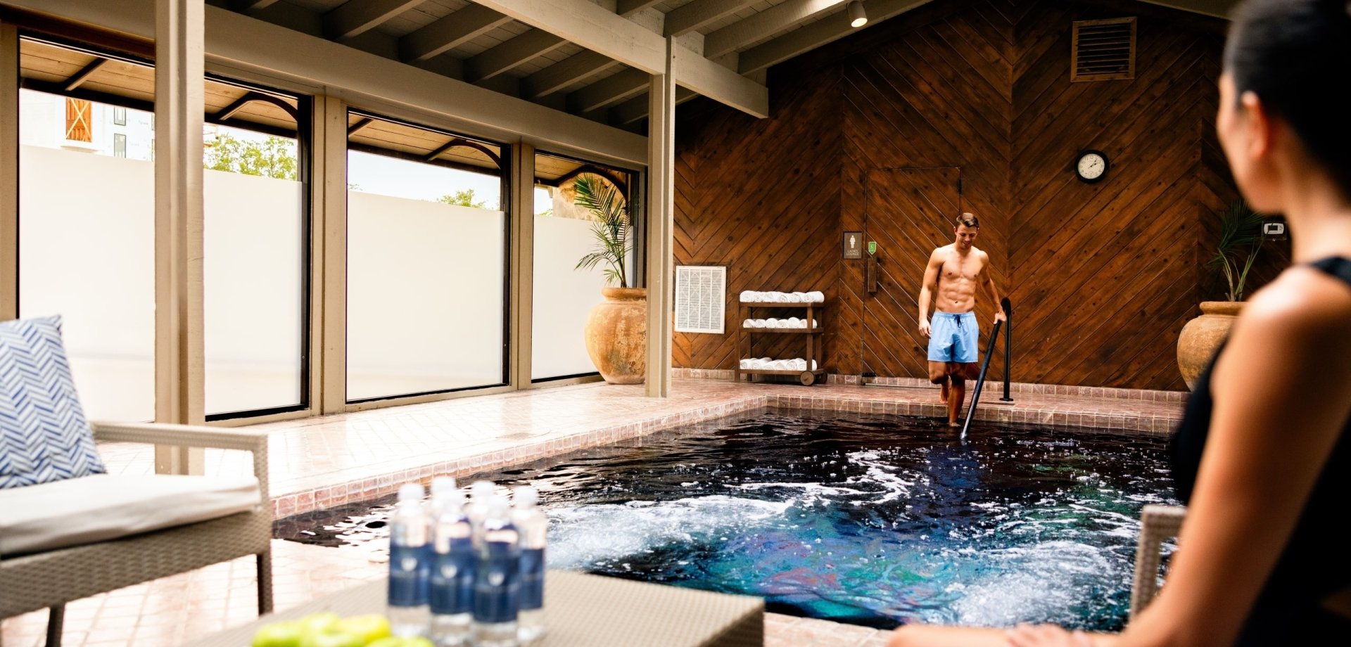 Man entering spa pool