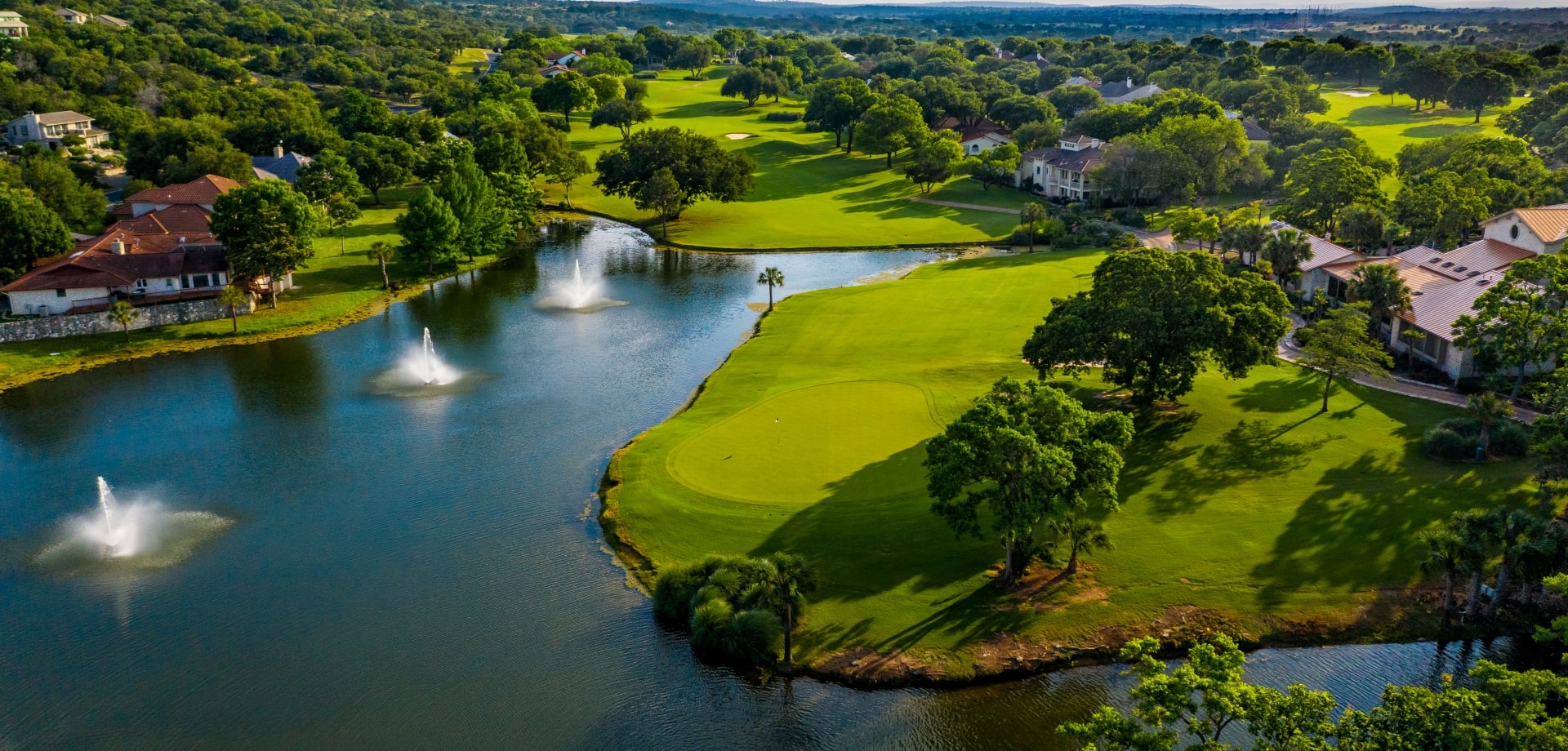 Golf course with water fountains