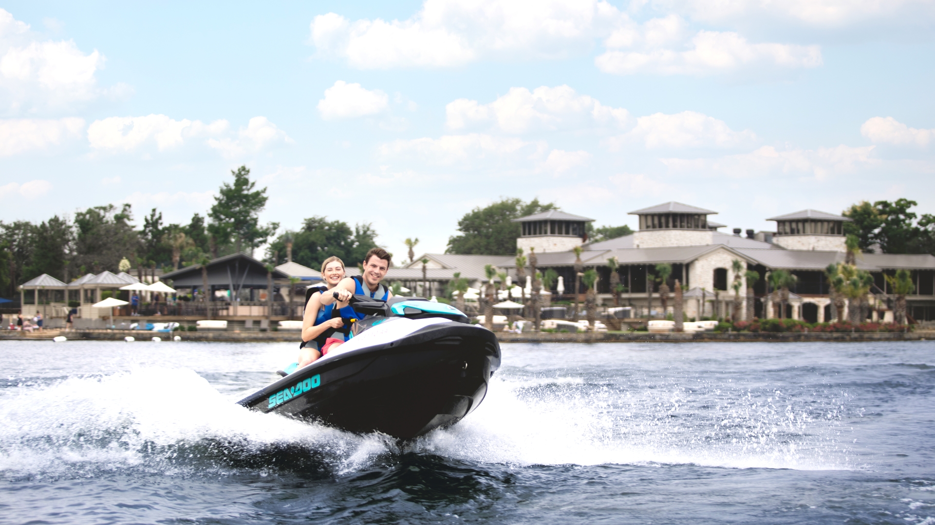 a man and woman enjoying a seadoo at Horseshoe Bay Resort